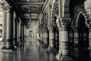 A marble hallway with intricate columns