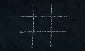 Upon a blackboard, an empty grid for the game tic tac toe has been drawn