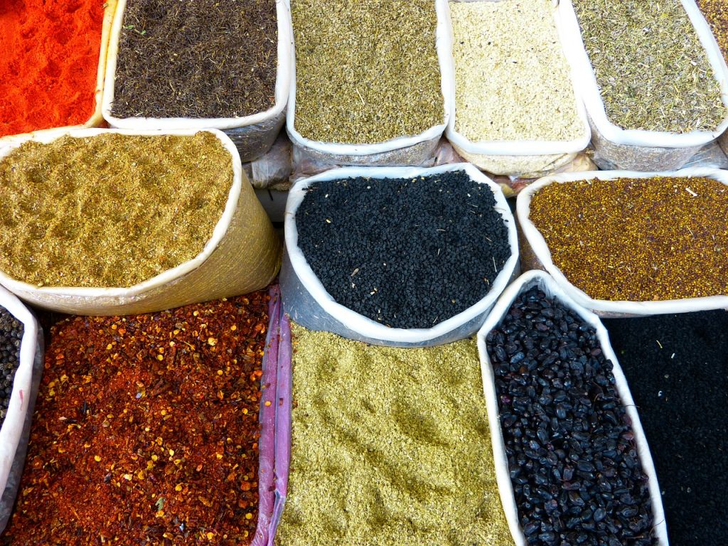 A variety of spices and grains offered at a stall