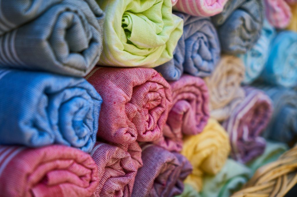 Bolts of cloth in a variety of colours