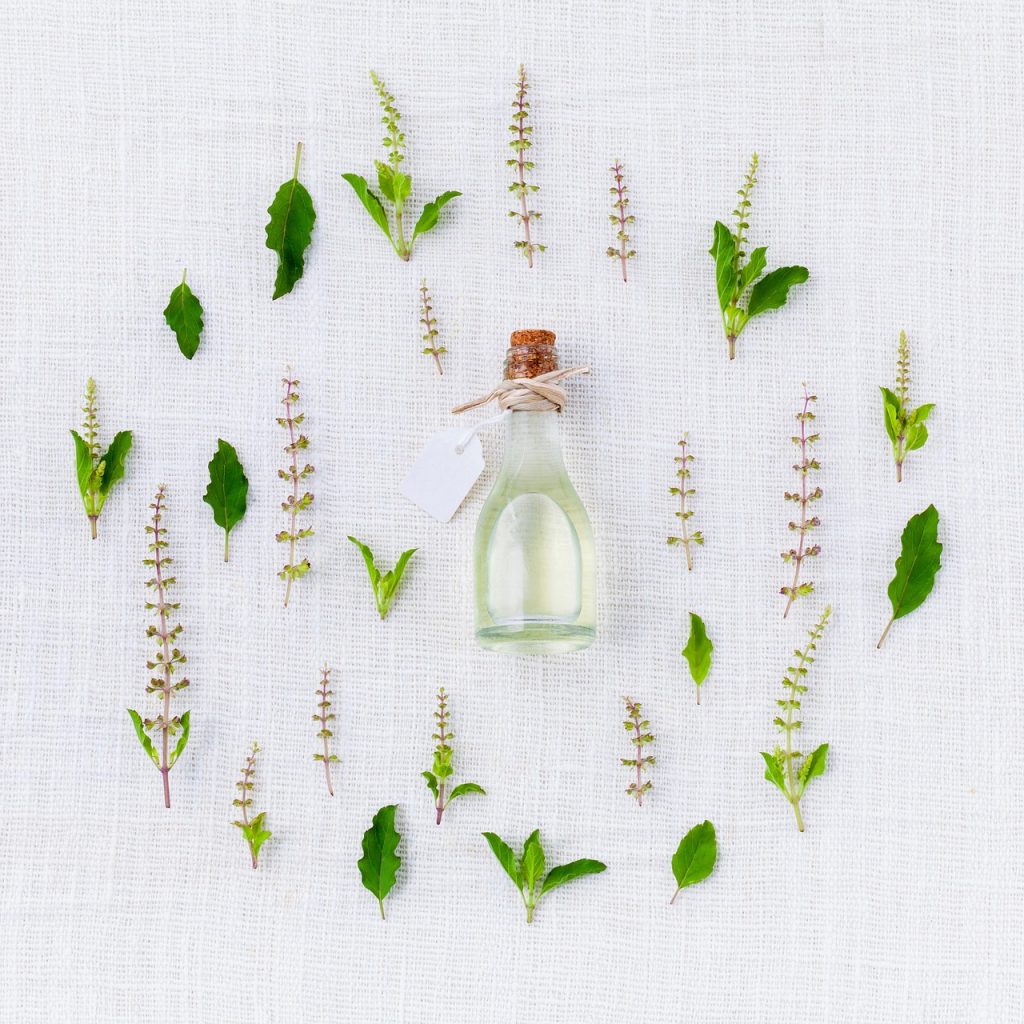 A bounty of herbs on display against a white cloth.