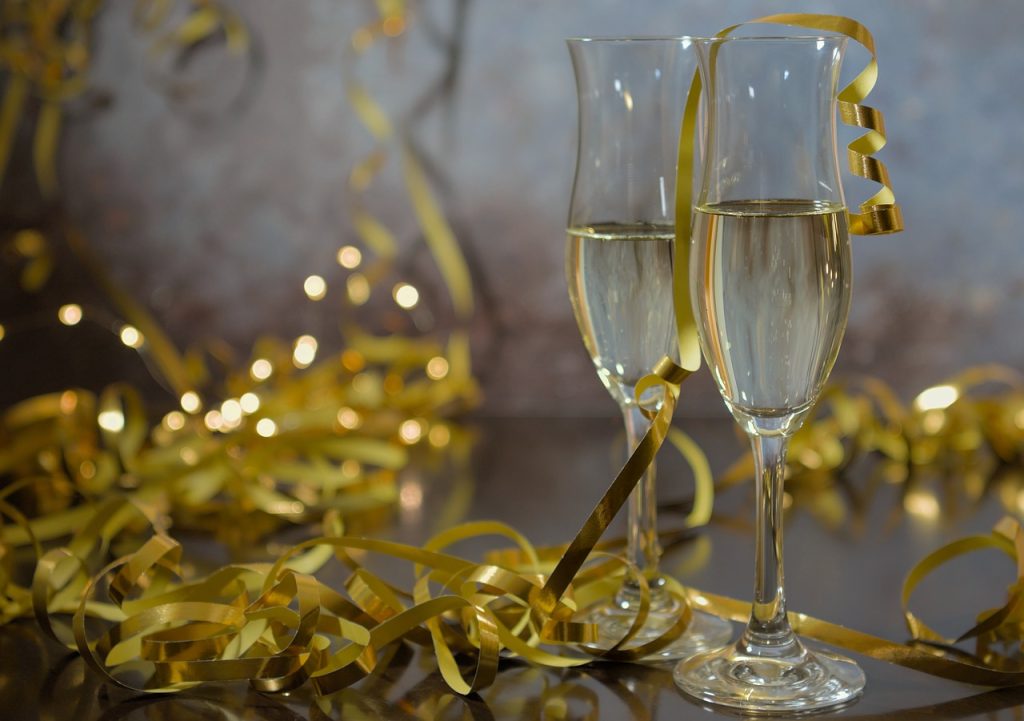 Champagne glasses and golden ribbons