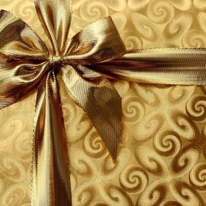 A golden present tied with a golden ribbon.