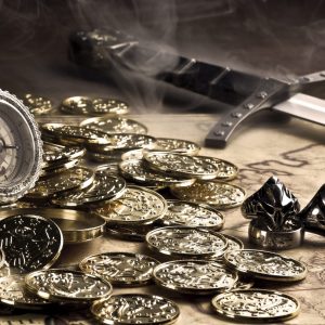 A pile of gold coins sits upon a table surrounded by trinkets.
